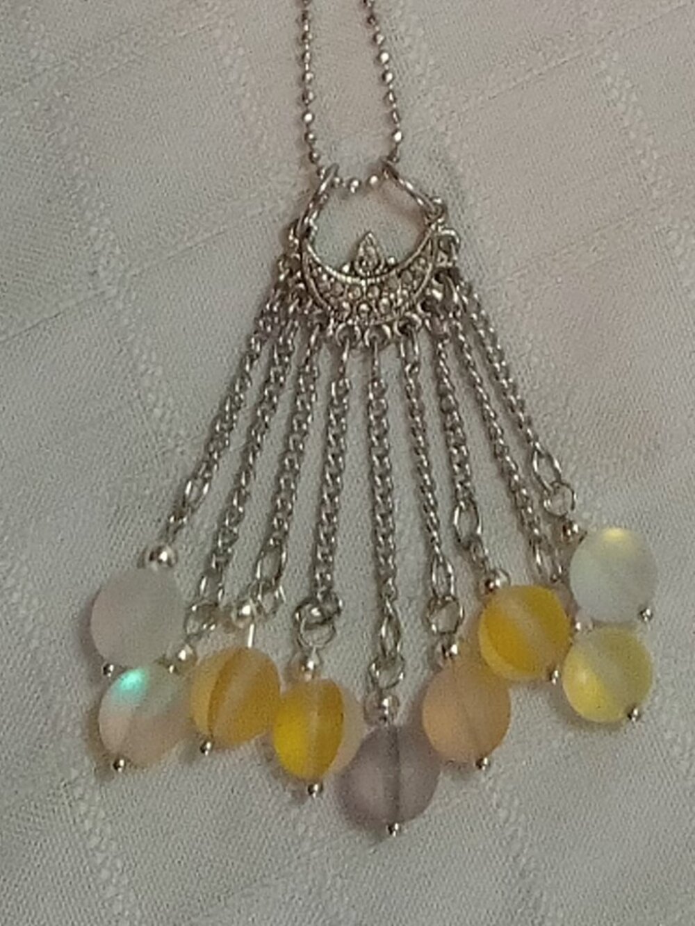 Exquisite handmade necklace featuring a half-moon-shaped Tibetan silver charm